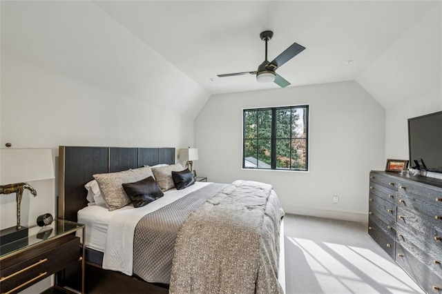 bedroom with ceiling fan, baseboards, vaulted ceiling, and carpet flooring