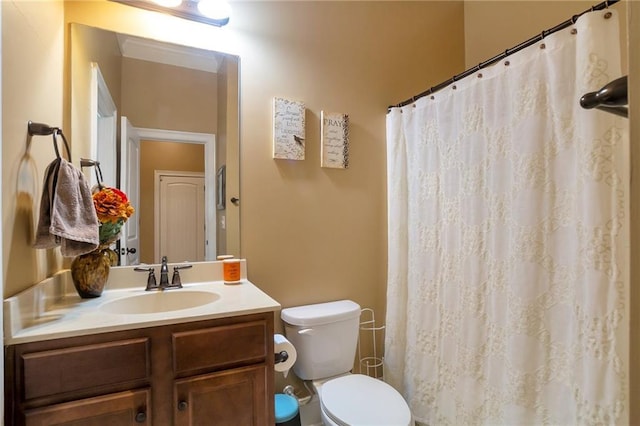 bathroom featuring curtained shower, toilet, and vanity