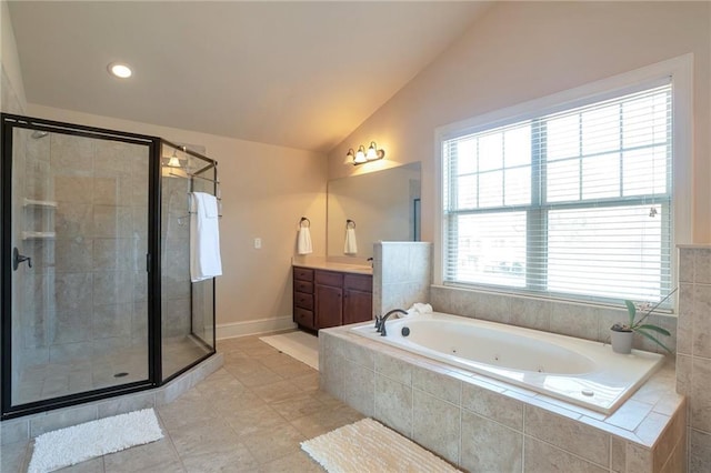 bathroom featuring vanity, independent shower and bath, tile patterned floors, and lofted ceiling