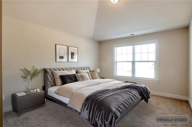 bedroom featuring visible vents, vaulted ceiling, carpet, and baseboards