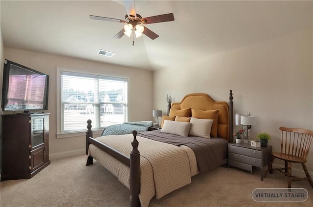 bedroom with light colored carpet, vaulted ceiling, ceiling fan, baseboards, and visible vents