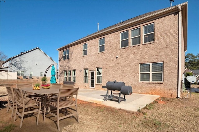 back of property with a patio