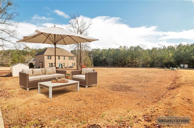 view of yard with an outbuilding, a patio, and an outdoor living space