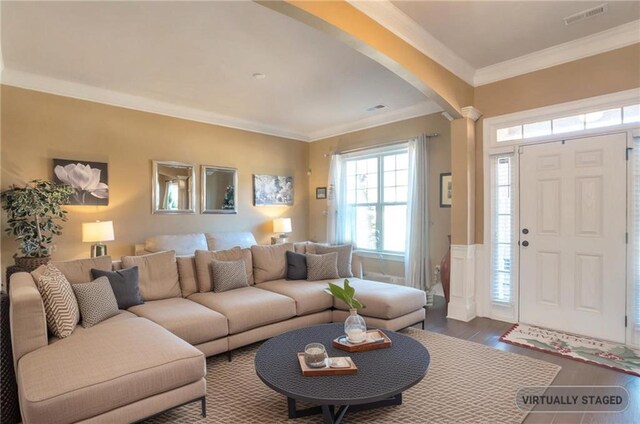 entrance foyer with crown molding and dark wood-type flooring