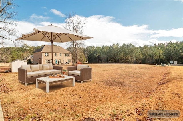 view of yard with a storage shed and outdoor lounge area