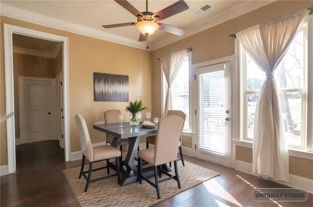 dining space with ceiling fan, crown molding, and dark hardwood / wood-style floors