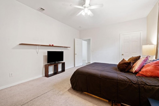 bedroom featuring visible vents, a ceiling fan, baseboards, and carpet floors