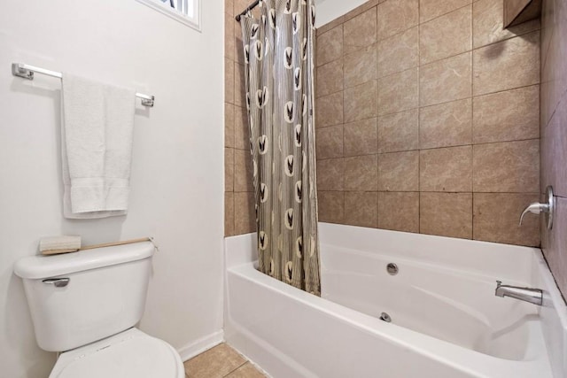 bathroom featuring tile patterned flooring, toilet, and shower / bath combo