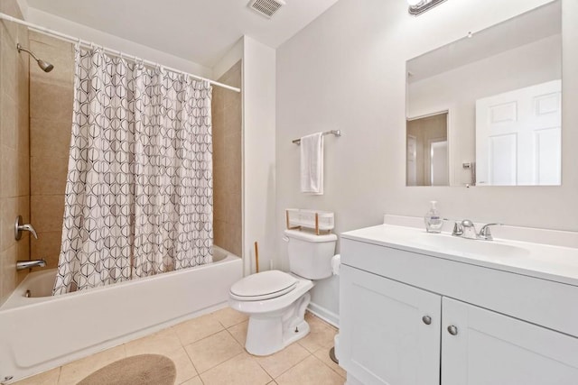 bathroom featuring visible vents, toilet, shower / bath combo with shower curtain, tile patterned floors, and vanity