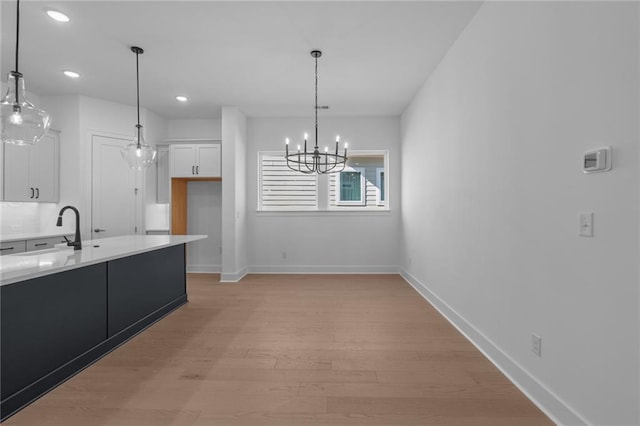 spare room with unfinished concrete floors, baseboards, and visible vents