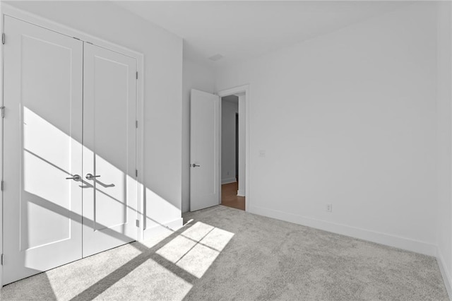 empty room with ceiling fan, baseboards, and wood finished floors