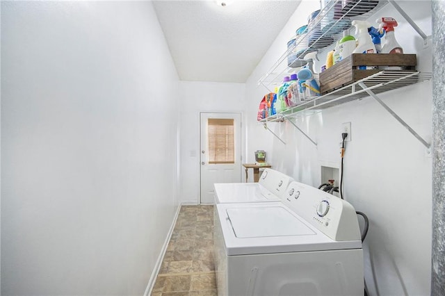 laundry area featuring washing machine and clothes dryer