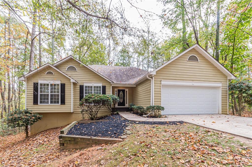 ranch-style house featuring a garage