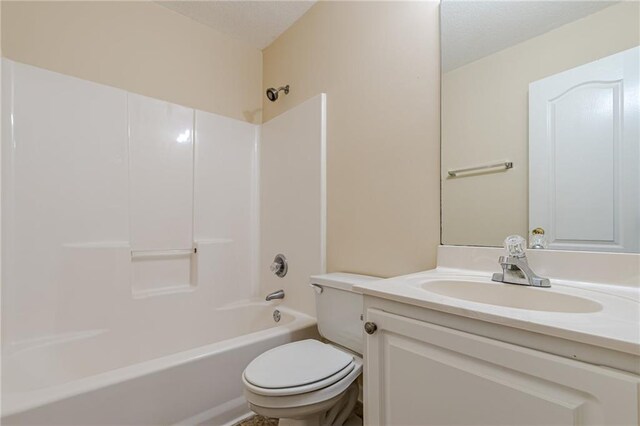 full bathroom with toilet, vanity, and shower / bathtub combination