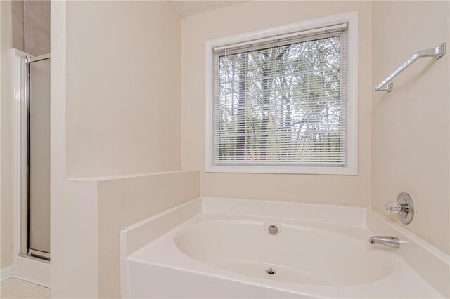 bathroom featuring plus walk in shower