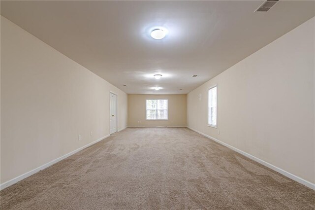 empty room featuring light colored carpet