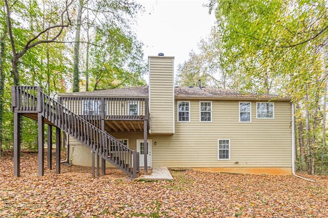 back of property with a wooden deck