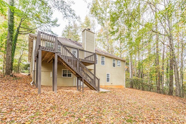 back of house featuring a deck