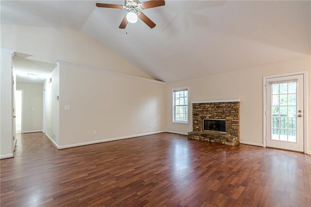 unfurnished living room with ceiling fan, dark wood-type flooring, and a wealth of natural light