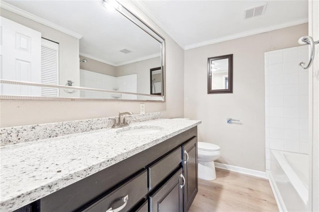 full bathroom featuring toilet, crown molding, hardwood / wood-style flooring, and vanity