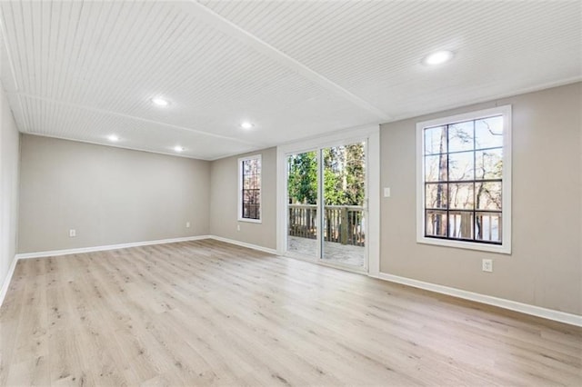 spare room with light wood-type flooring