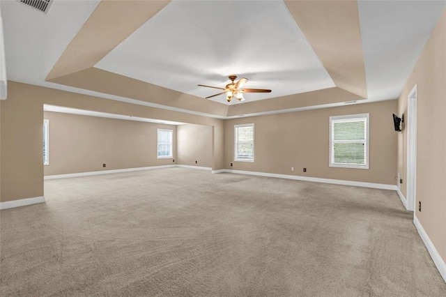 4499 Bellemeade Dr, Douglasville, GA 30135 - spare room with carpet flooring, a ceiling fan, baseboards, and a raised ceiling