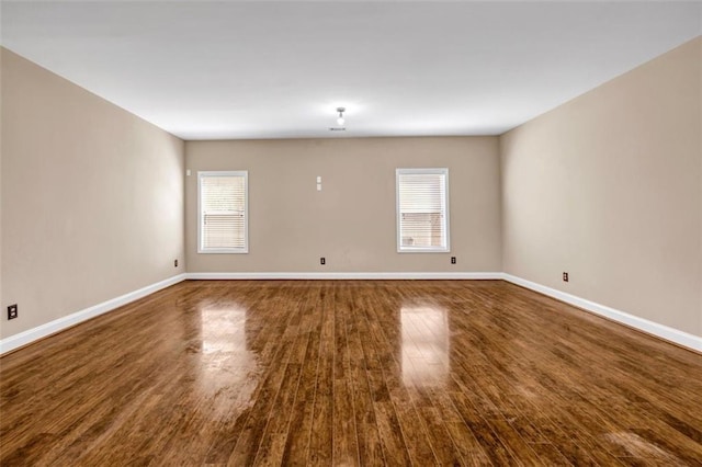 4499 Bellemeade Dr, Douglasville, GA 30135 - unfurnished room featuring dark wood finished floors, plenty of natural light, and baseboards