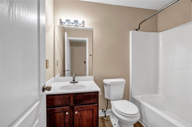 4499 Bellemeade Dr, Douglasville, GA 30135 - full bathroom featuring shower / bathing tub combination, baseboards, toilet, and vanity