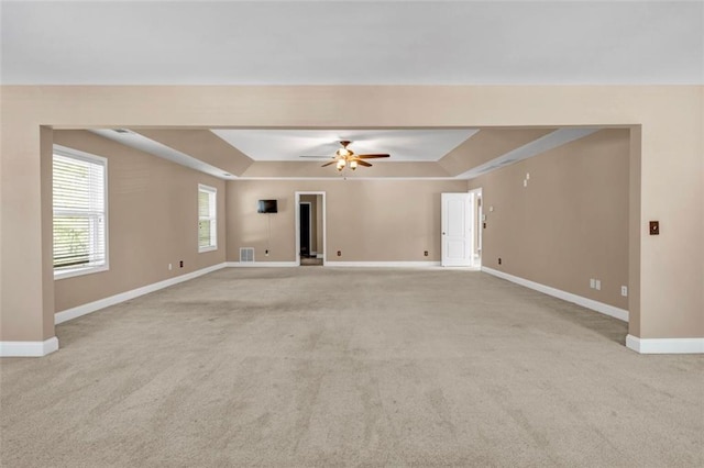 4499 Bellemeade Dr, Douglasville, GA 30135 - unfurnished living room featuring light carpet, baseboards, and a raised ceiling