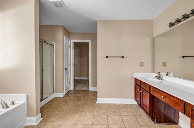 4499 Bellemeade Dr, Douglasville, GA 30135 - full bathroom featuring a bath, baseboards, visible vents, and a stall shower