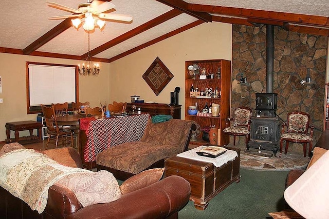 living room featuring lofted ceiling with beams, a wood stove, and a textured ceiling