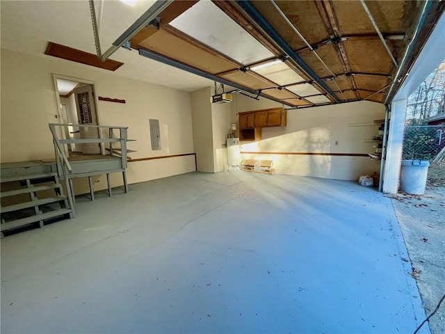 garage featuring a garage door opener and electric panel