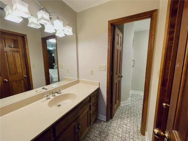 bathroom with vanity and baseboards
