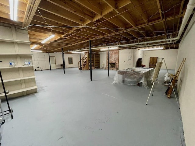 unfinished basement featuring stairs