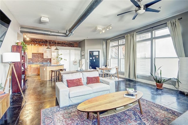 350 Peters St SW Unit 19, Atlanta, GA 30313 - living room with finished concrete floors, a ceiling fan, and track lighting