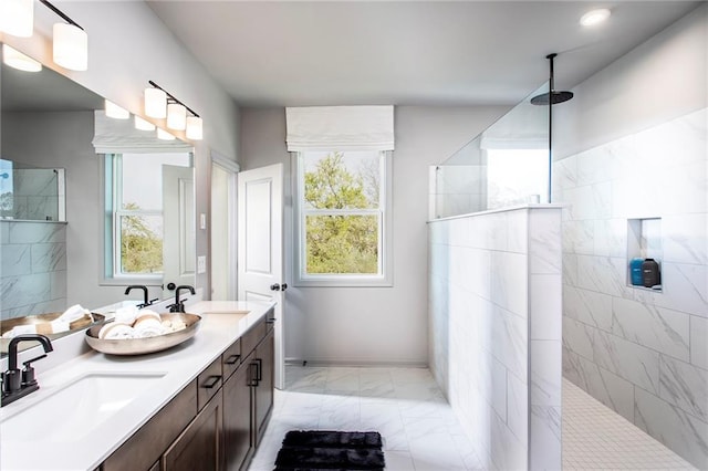 4720 Montane St, Cumming, GA 30028 - bathroom featuring marble finish floors, double vanity, a walk in shower, and healthy amount of natural light