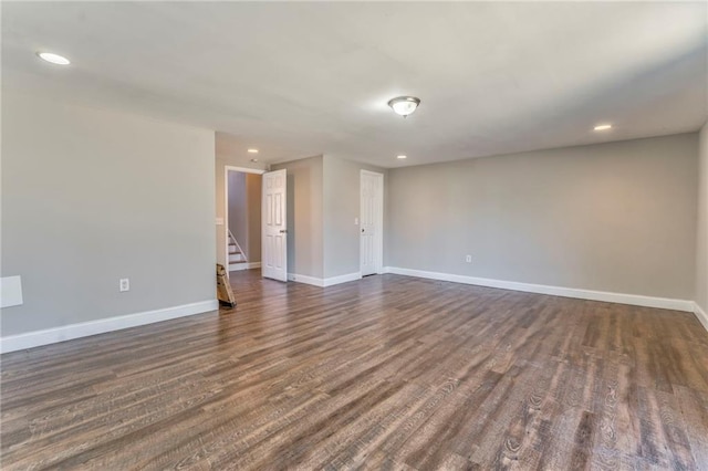 empty room with dark wood-type flooring