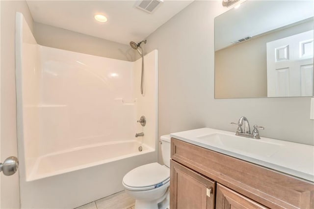 full bathroom featuring vanity, bathtub / shower combination, and toilet