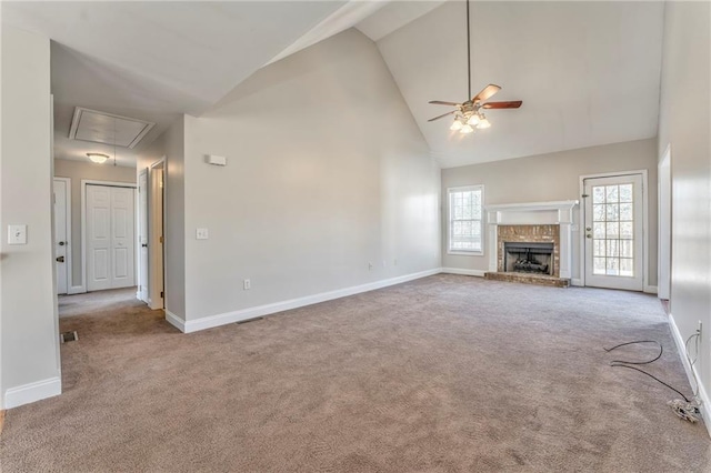 unfurnished living room with light carpet, a brick fireplace, high vaulted ceiling, and ceiling fan