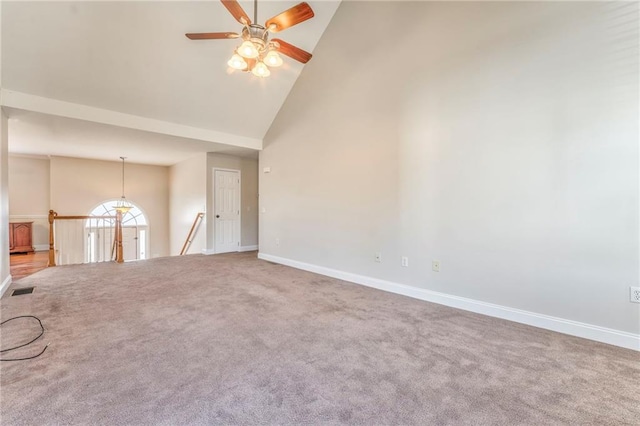 unfurnished living room featuring ceiling fan, carpet flooring, and high vaulted ceiling