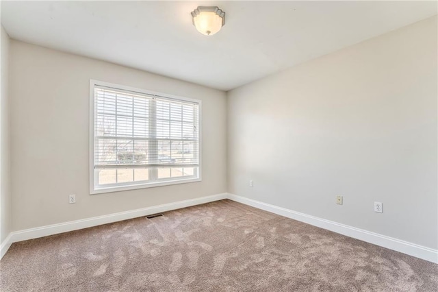 unfurnished room with carpet flooring