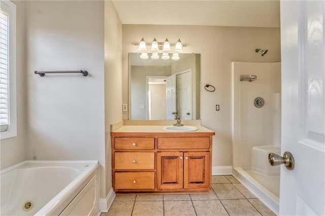 bathroom with tile patterned floors, independent shower and bath, and vanity