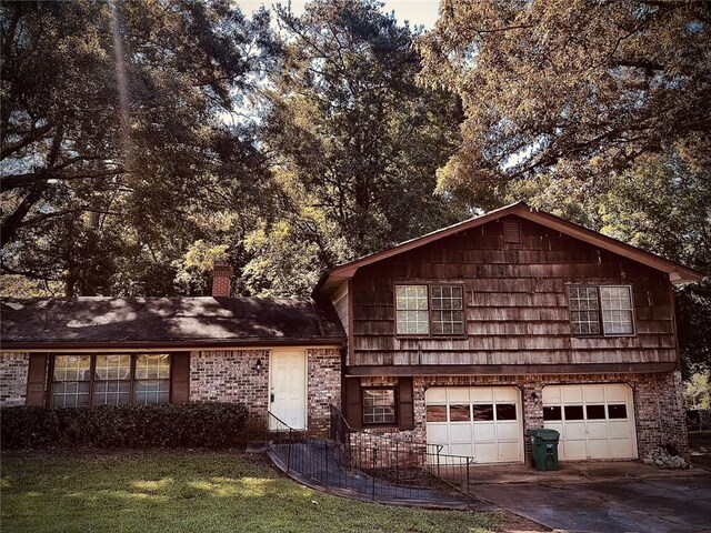 front facade featuring a front yard and a garage