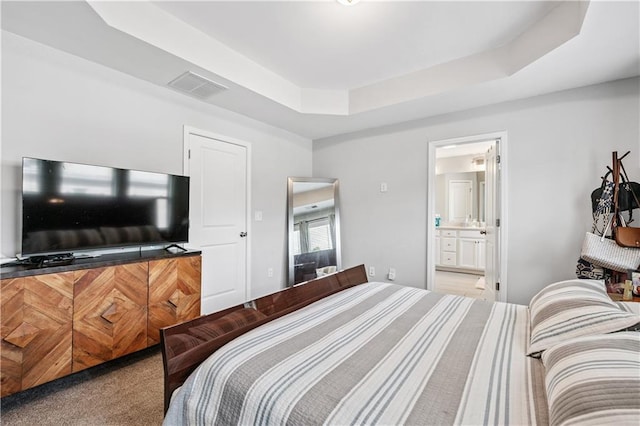 350 Provenance Dr, Atlanta, GA 30328 - carpeted bedroom featuring a raised ceiling and ensuite bathroom