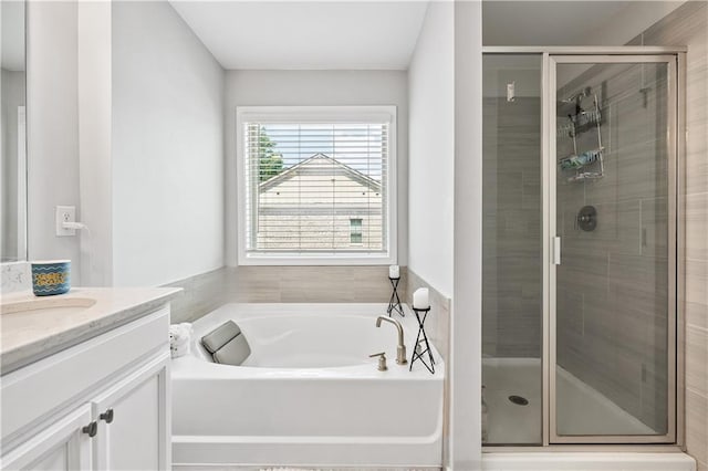 350 Provenance Dr, Atlanta, GA 30328 - bathroom featuring vanity, a garden tub, and a stall shower