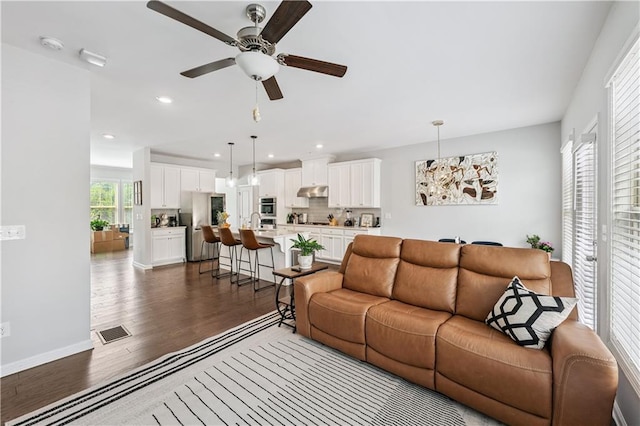 350 Provenance Dr, Atlanta, GA 30328 - living room with dark wood finished floors, a ceiling fan, and recessed lighting