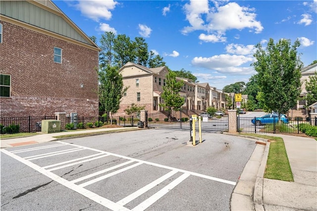 350 Provenance Dr, Atlanta, GA 30328 - view of asphalt street featuring curbs, sidewalks, traffic signs, and a residential view