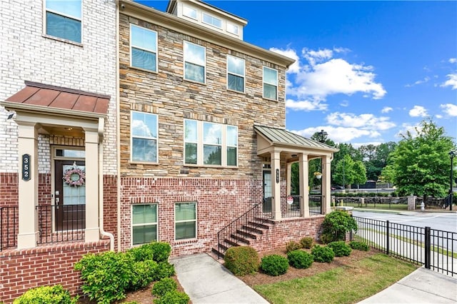 350 Provenance Dr, Atlanta, GA 30328 - view of front of home with a standing seam roof and brick siding