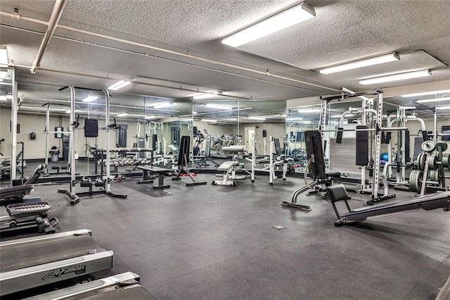 workout area featuring a textured ceiling