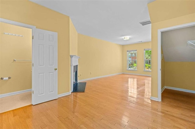 unfurnished living room featuring light hardwood / wood-style floors